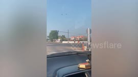 Kind motorcycle rider runs to middle of junction to save lost kitten