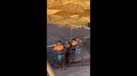 Four men attempt impromptu water pipe pull-up, hilarious fail ensues
