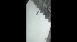 Window cleaning platform spins round during violent storm in Thailand