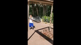 Chinese boy amazes by slicing through hanging beer cans with flying cards
