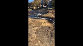 River flowing on a sunny day through downtown.