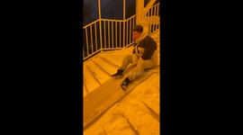Man Sliding Down Snowy Stairs Ends Up in Hilarious Fail in Northeast China