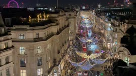 Crowds cheer as Regent Street’s Christmas lights are switched on in London