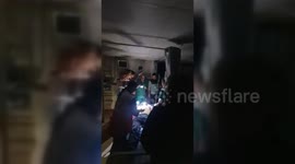 Doctors operate using torches at Al-Quds Hospital in Gaza