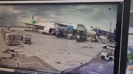 Luggage trolleys come loose and crash into plane engine