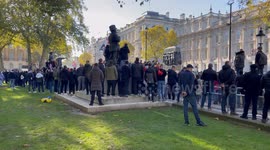 Veterans, football supporters and protesters fall silence at the Cenotaph on Whitehall at 11am on 11/11/2023