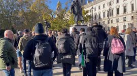 Right wing counter protesters jeer and swear at pro-Palestinian demonstrators as they make their way through Parliament Square