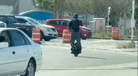 Futuristic rider weaves through busy traffic to get to his destination!!!