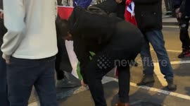 Far right hooligans attempt to burn Palestine flag in London