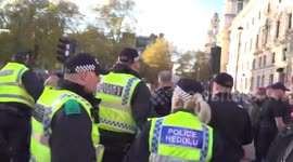 Violent scuffles between police and counter-demonstrators in Parliament Square on Armistice Day in London, UK