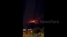 Sky glows orange as Mount Etna spews lava and ash in latest eruption