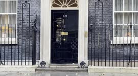 David Cameron walks out of Downing Street after being named new foreign secretary