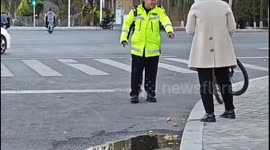 Persistent Pooch Follows On-Duty Traffic Policeman in Northwest China