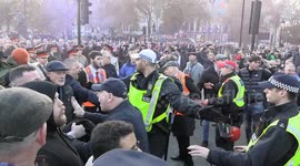 Remembrance Day protester appears to spit on Met Police Sergeant as Annual Orange march enters parliament Street in London.