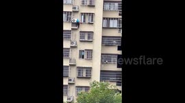 Heroic man rescues boy dangling from 7th floor of building in China