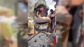Palestinians in Rafah chop down wood for fires to bake bread as fuel runs out