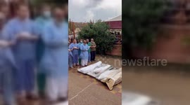 Doctors Pray At Mass Funeral in Khan Yunis, Palestine