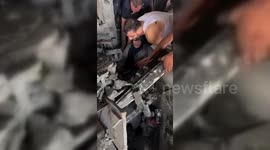 Palestinian Woman Rescued From Rubble Of Her Home in Gaza