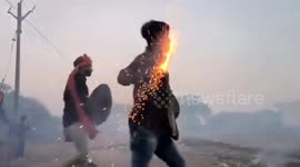 Great balls of fire! 'Hingot war' breaks out as people hurl fireballs at each other after Diwali in India