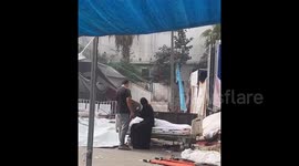 Palestinian Mother Awaits Burial Of Her Son in Gaza