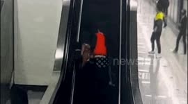 Quick-thinking Chinese boy shields grandmother from escalator fall