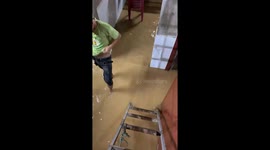 People quickly moved their furniture and livestock up high when floodwaters suddenly entered their homes