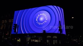 Piccadilly Circus lights display the Coronation Food Project for the Kings 75 birthday in London, UK