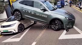Car reverses onto roof of another vehicle as driver mistakes accelerator for brake