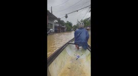 Locals travel via boat after heavy rain causes flooding in Vietnam