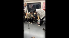 Chinese College Student Cares for Sleepy Child Left Behind on Subway