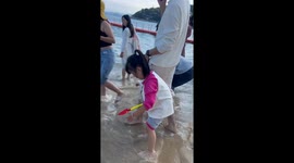 Drowning Girl Rescued by Kind Stranger at Seaside in Southern China