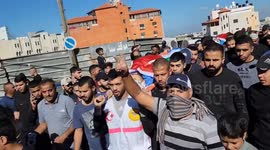 Mourners carry bodies of Palestinians killed in raid on West Bank town