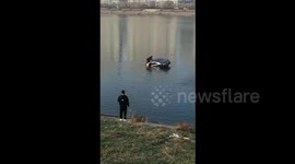 Brave fisherman saves driver after car plummets into river in China