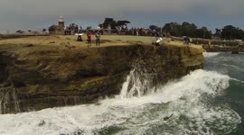 Aerial footage of surfers at Steamer Lane, Santa Cruz