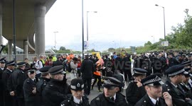 Police trying to move protesters from blocking the road (Occupy vs Arms-Fair London)