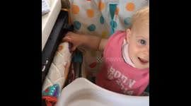 Baby makes a beat with oven door