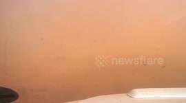 Dramatic footage of a dust storm engulfing a car in South Africa