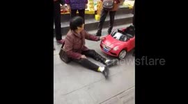 Woman refuses to stand up after being hit by toy car