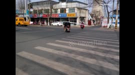 Man carries six-metre long extrudate while driving on road