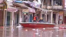 Flood happens in several cities because of rainstorm and hail in southern China