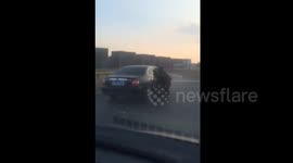 Woman stops hit-and-run car is dragged by it in fast speed