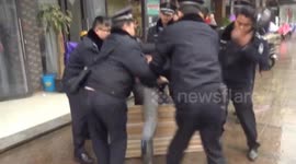 Man 'kisses' police officer TWICE during scuffle