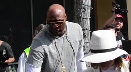 Khloe Kardashian and Lamar Odom cause a paparazzi frenzy as they head to Easter church service