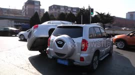 Buick car rides on SUV after they crash
