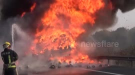 Villagers loot household items off burning lorry