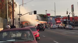 Bus and car collide in Los Angeles causing fire