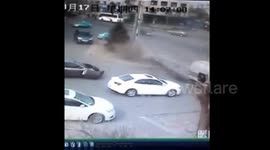 Lorry turns over smashing car
