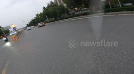 Chinese motorbiker helps fellow rider who lost their balance