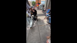 Adorably friendly boy makes strangers smile by greeting them with a 'High-Two'
