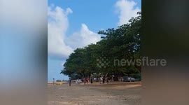 Chinese tourists scream on Thai beach in the early morning